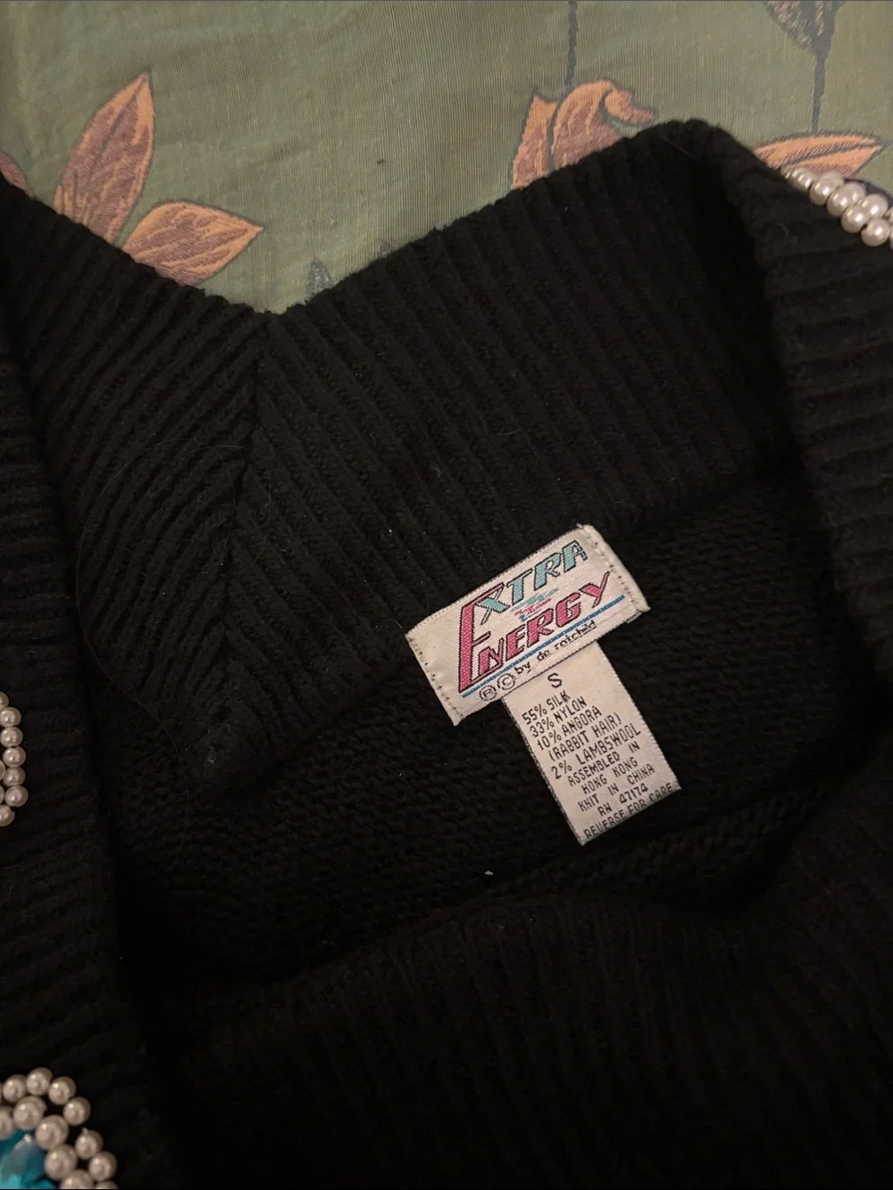 Black Off-Shoulder Sweater with Multicolor Gem Accents
